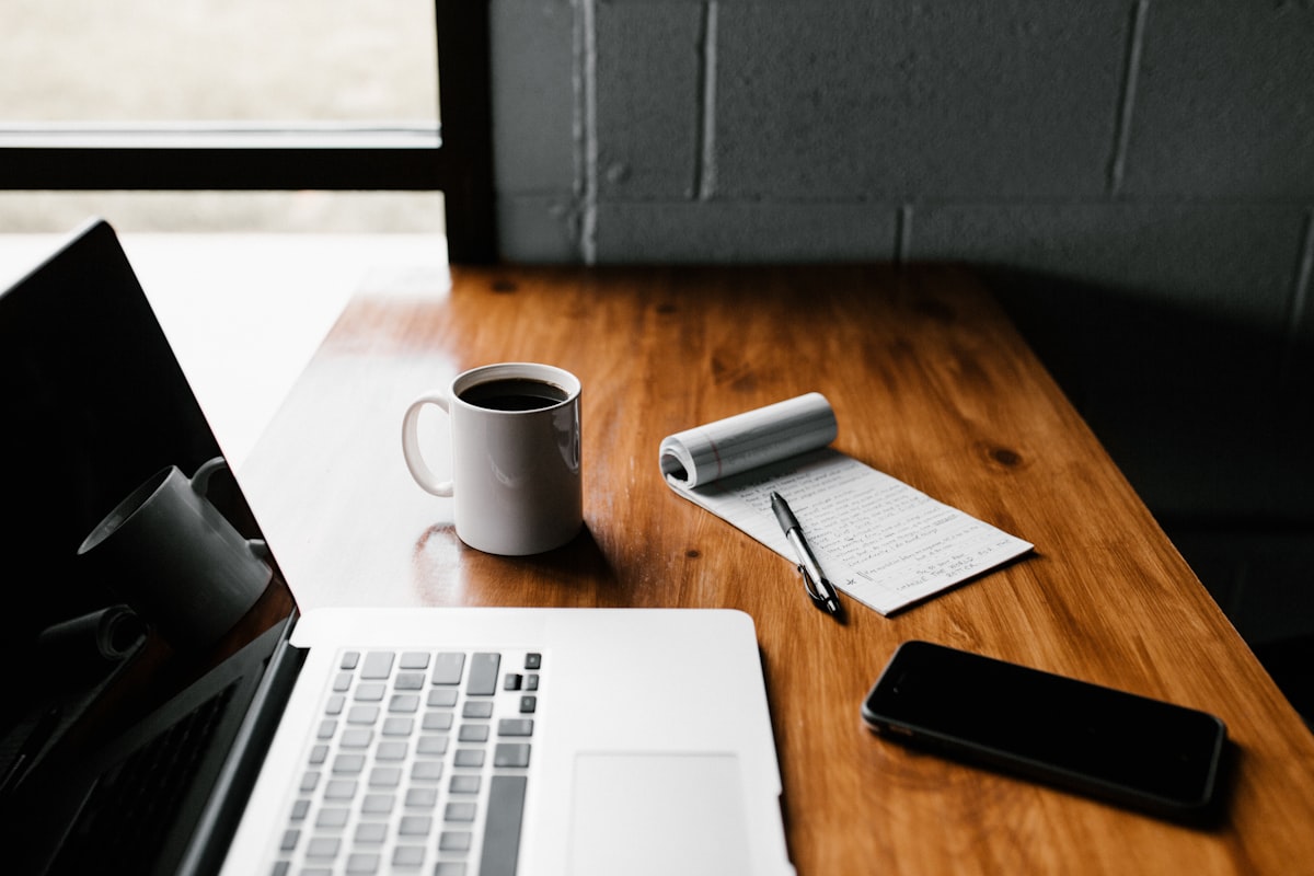 Creator workspace with laptop and digital content tools